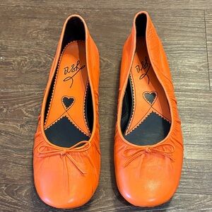 Orange ballet flare with bow detail